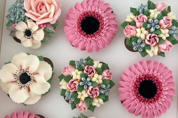 closeup of intricately decorated cupcakes