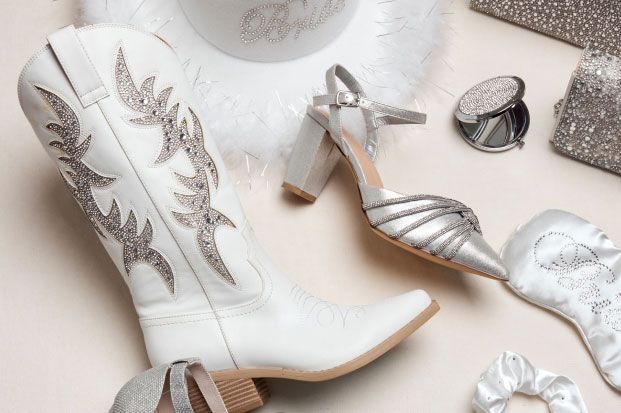 collection of shoes and various accessories on a table