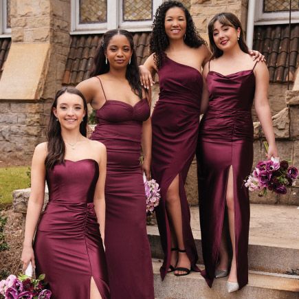 bridesmaid group in wine posing on steps