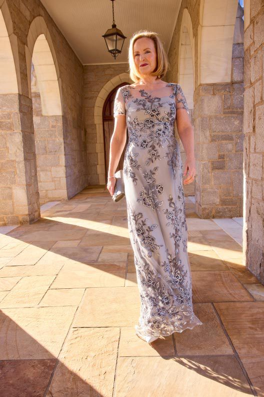 woman in occasion dress walking outside