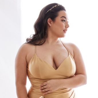 bridesmaids in gold dress wearing a headband