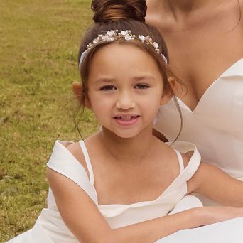 closeup of flowe girl sitting with the bride