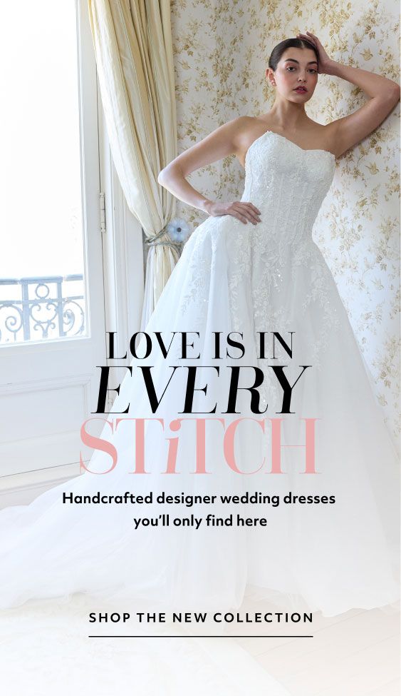 woman in wedding dress leaning against a wall promoting love is in every stitch handcrafted designer wedding dresses you'll only find here shop the new collection