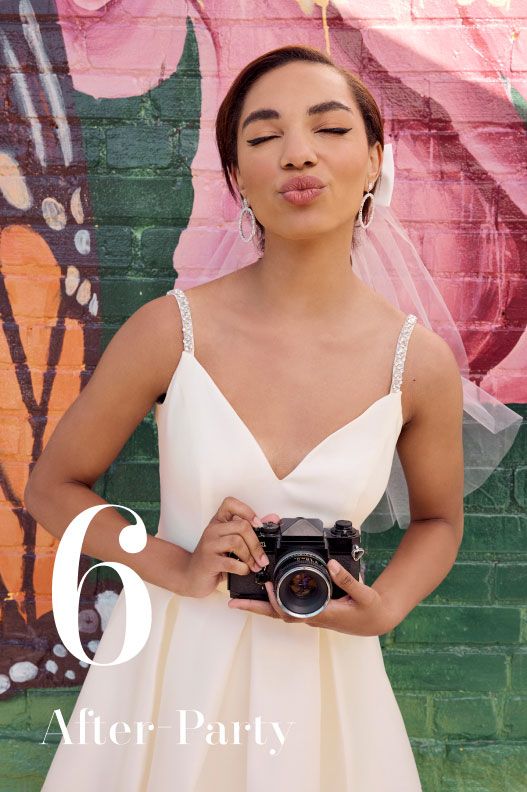 woman in wedding dress holding a camer and making a kissy face for 6 after-party