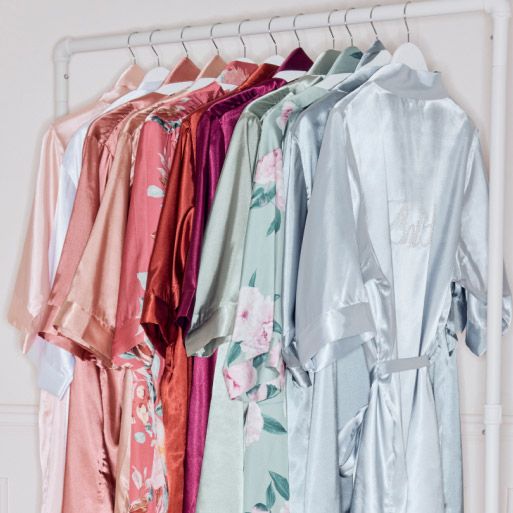 collection of various robes on a dress rack