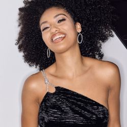closeup of woman in black occasion dress