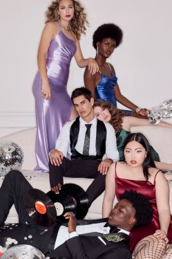 group of prom goers hanging out on a couch