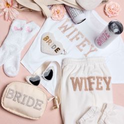 collection of bridal party gifts spread out on a table