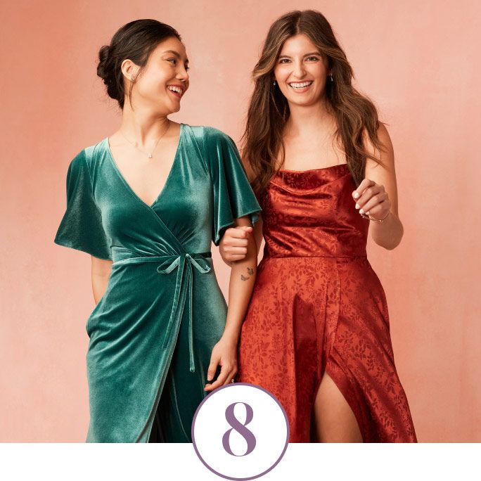 2 bridesmaids interlocking arms and walking