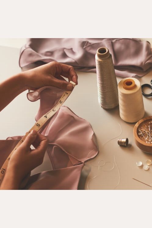 hands at work altering a dress