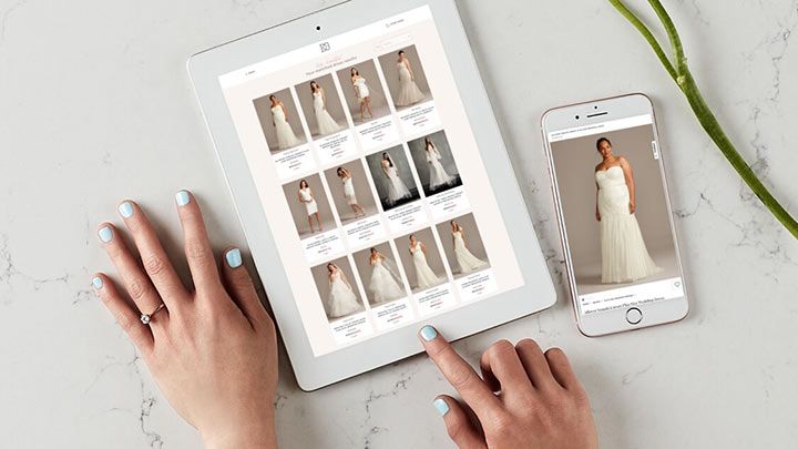 hands using tablet and phone with wedding quiz on them