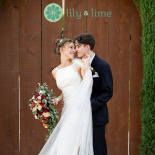 groom kissing bride promoting lily & lime