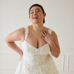 bride laughing an showing her ring