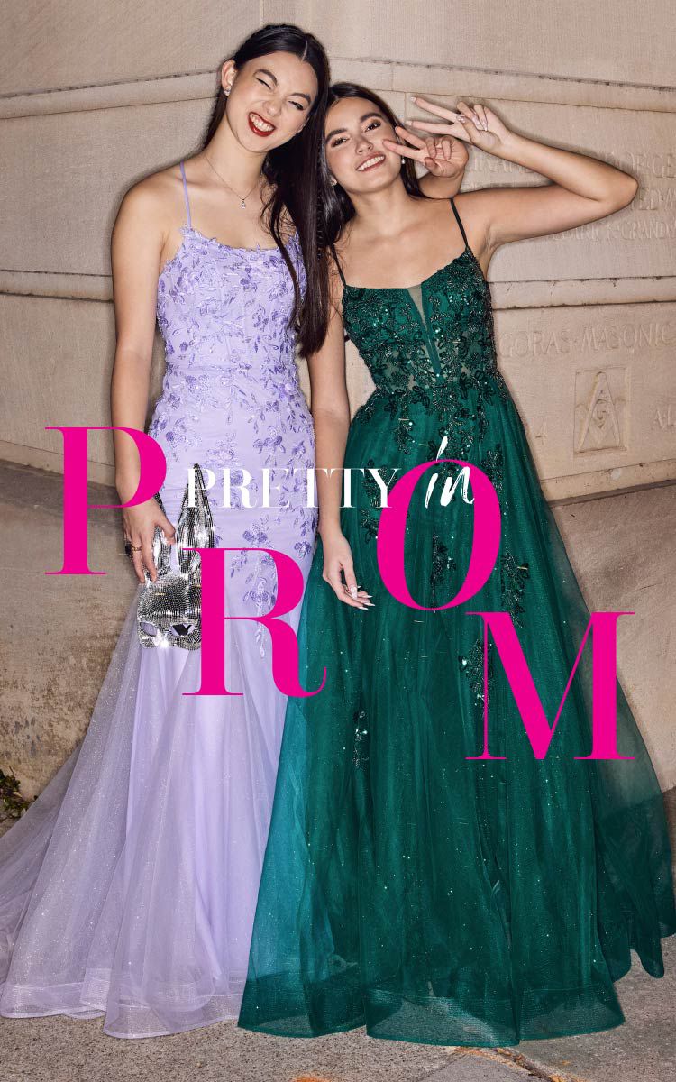 two girls in prom dresses standing outside and flashing thepeace sign promoting pretty in prom