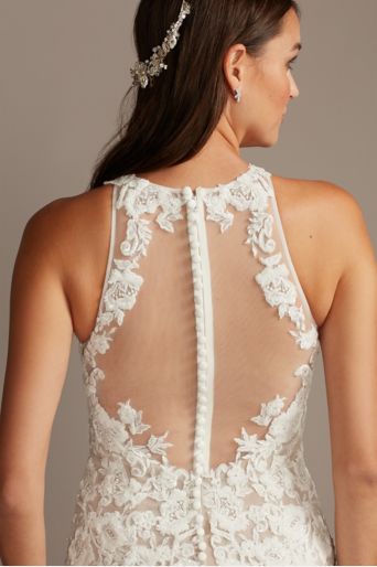 back of a bride wearing a lacy sheath wedding dress