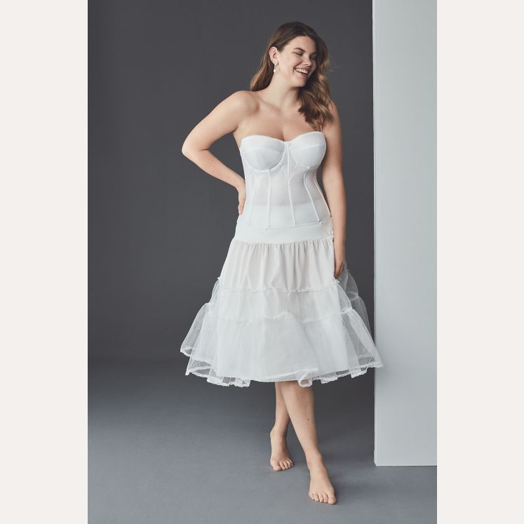 bride in white tea length slip