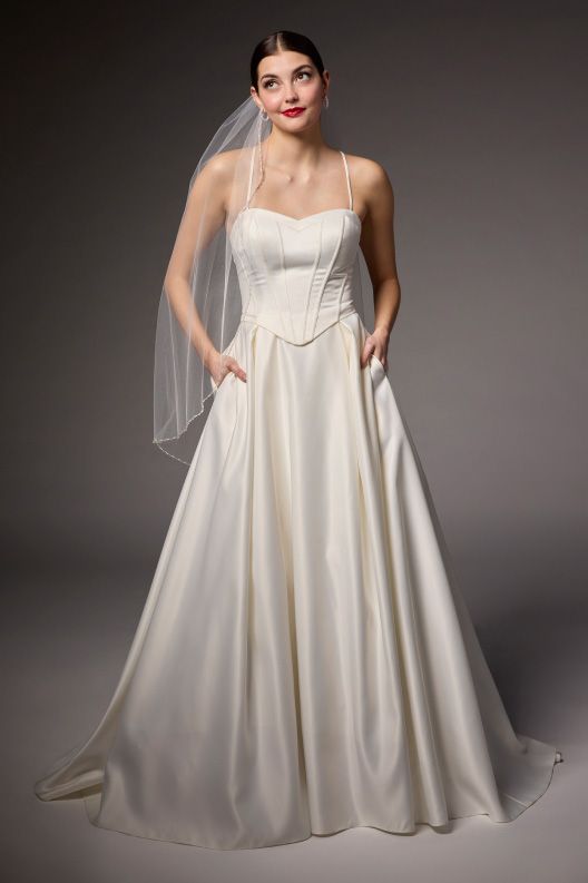 woman in a wedding dress by the edit