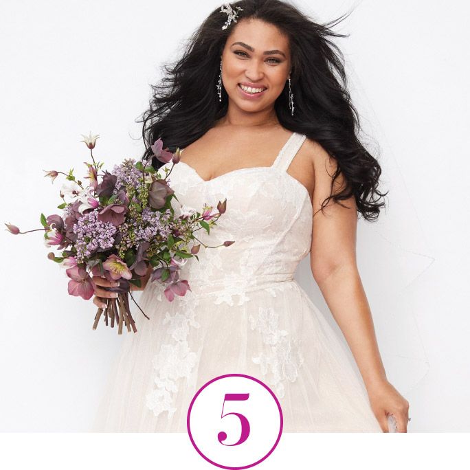 woman holding a bouquet with a hair clip in her hair