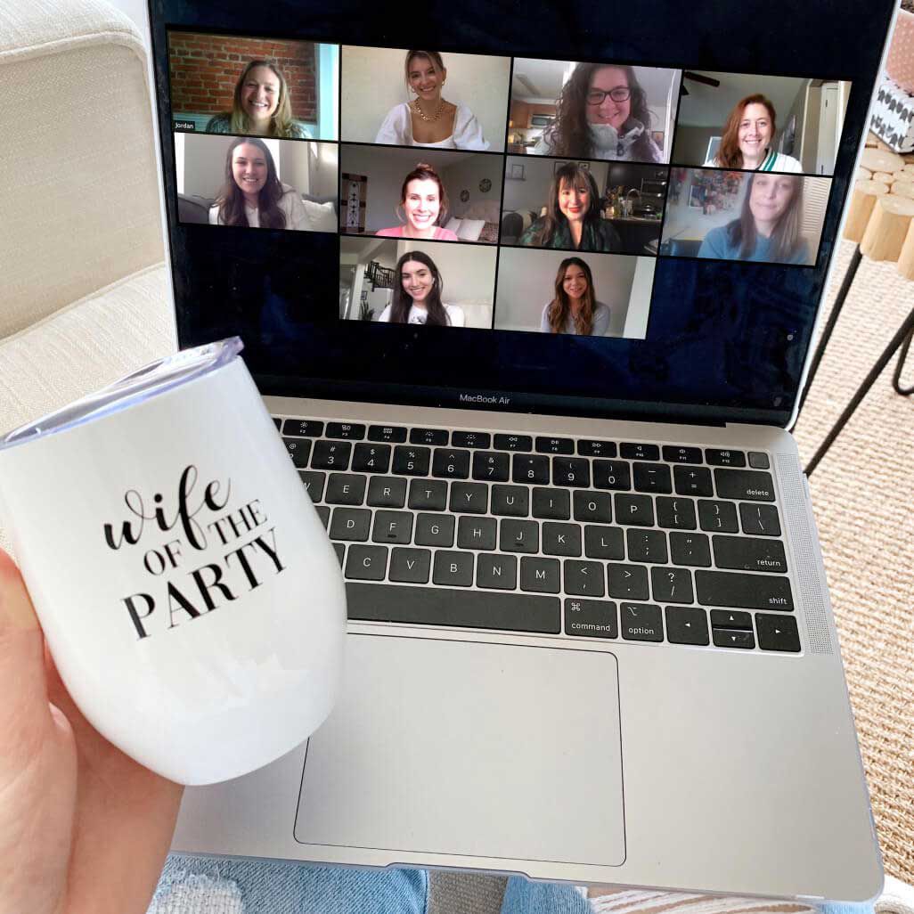 bride on a zoom call with bridesmaids on a laptop